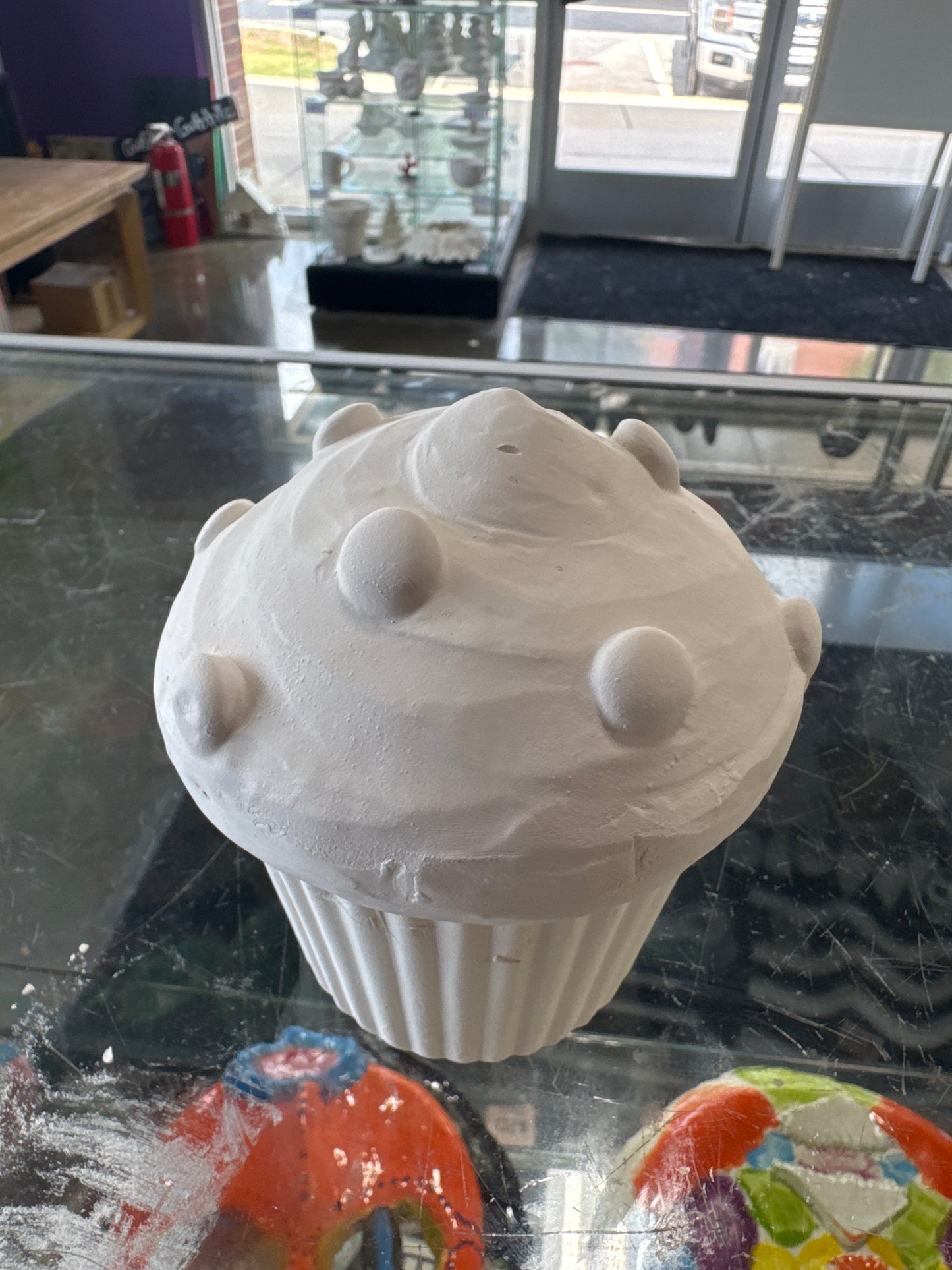 Cupcake Box with round sprinkles in frosting