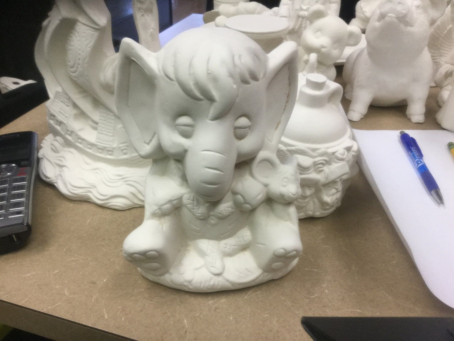 Elephant with mouse eating peanuts