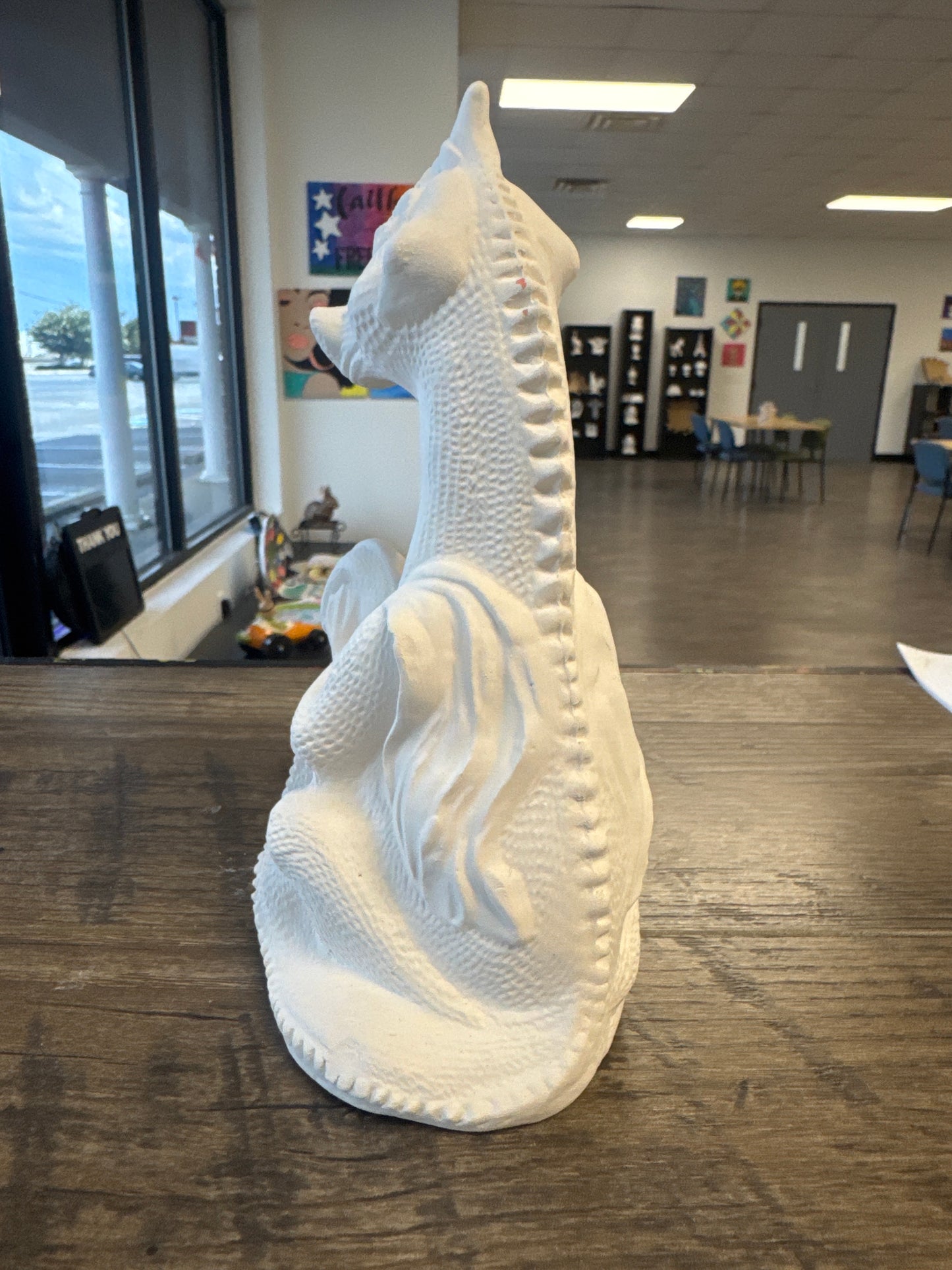 Dragon holding his tail