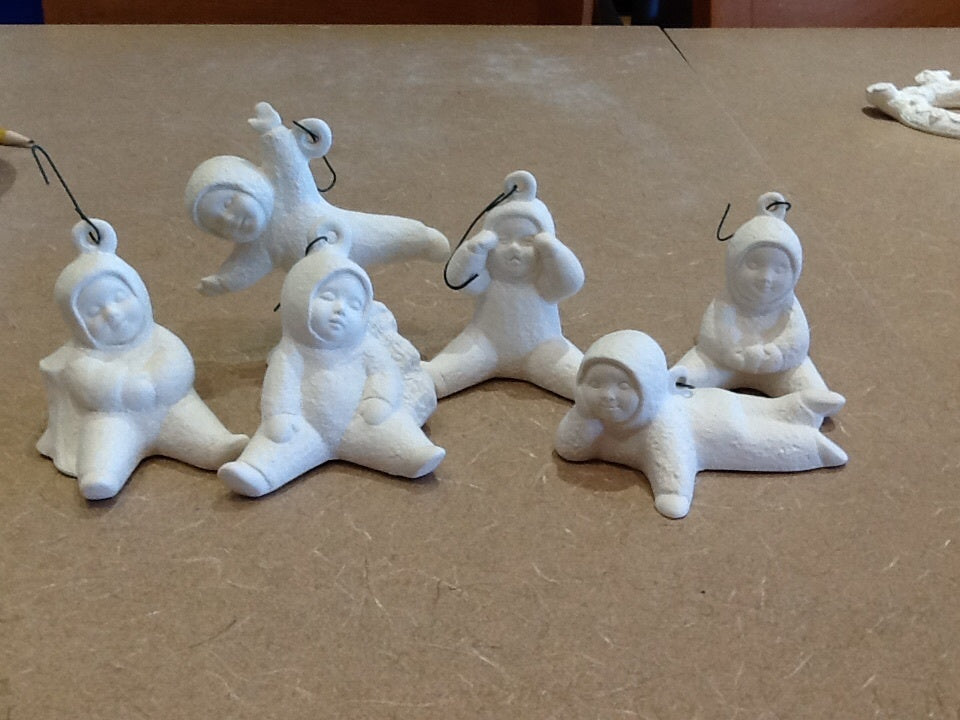 Assorted child playing in snowsuit ornaments