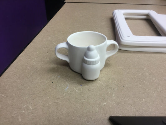 Baby cup with bottle on it