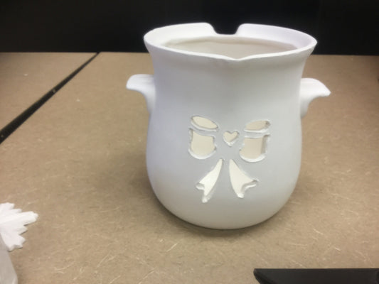 Cut out bow pot candle holder