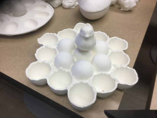 Cracked egg with chick egg holder