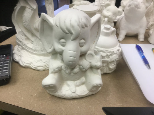 Elephant with mouse eating peanuts