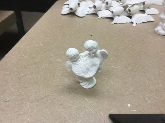 Extra smal cherubs with baby figurine